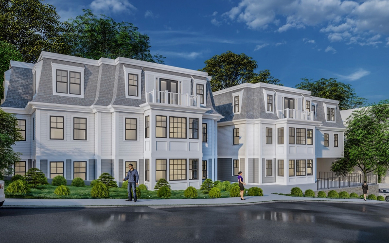 Matching white townhomes with balconies side-by-side