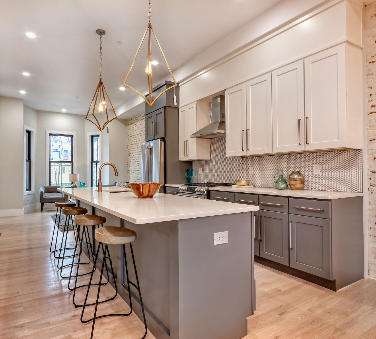 White and grey kitchen with gold accents