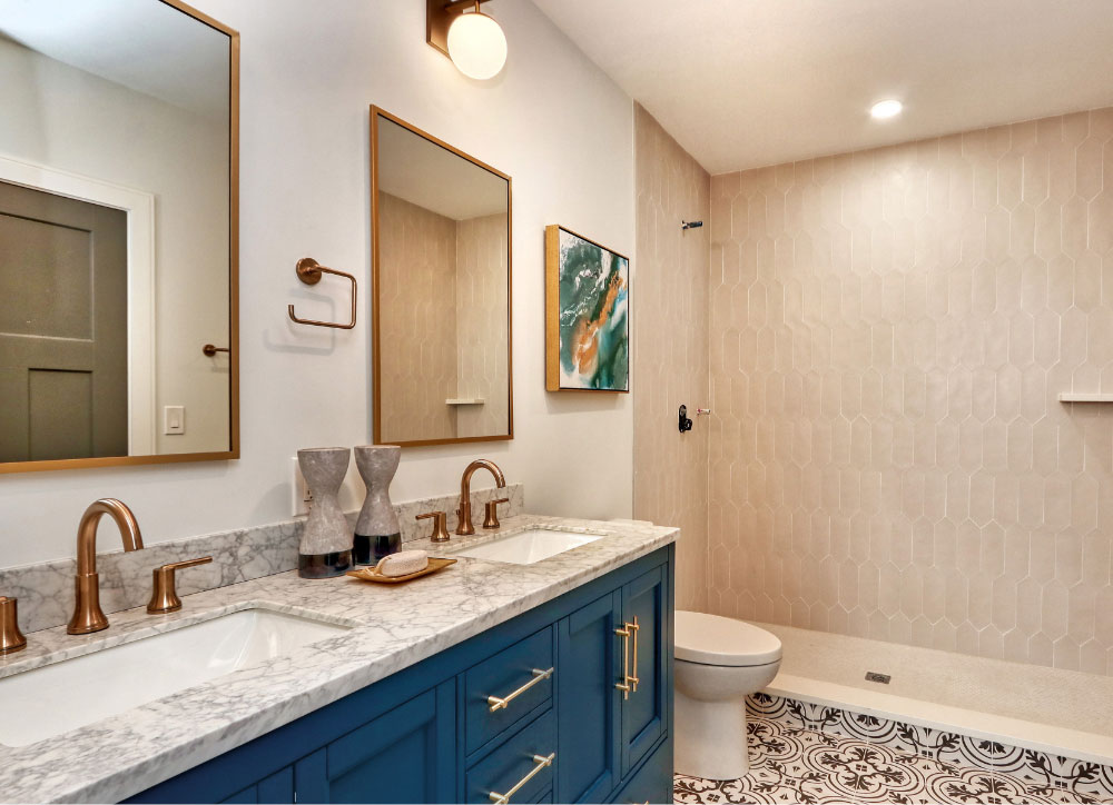 Bathroom with standing shower and decorative tile throughout