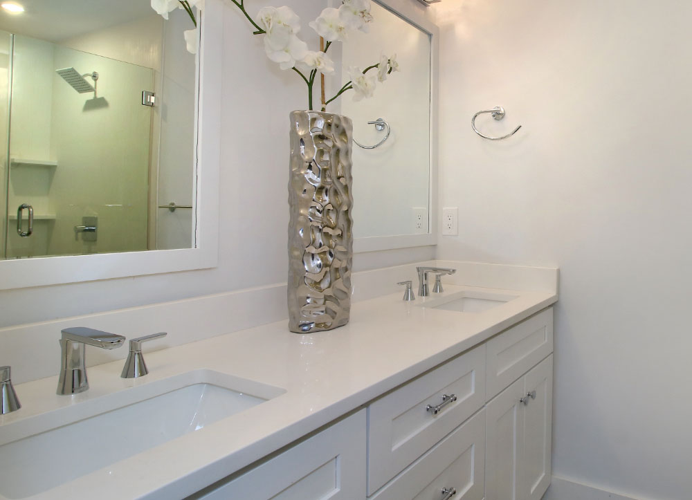 Bathroom with dual sink vanity and white counters